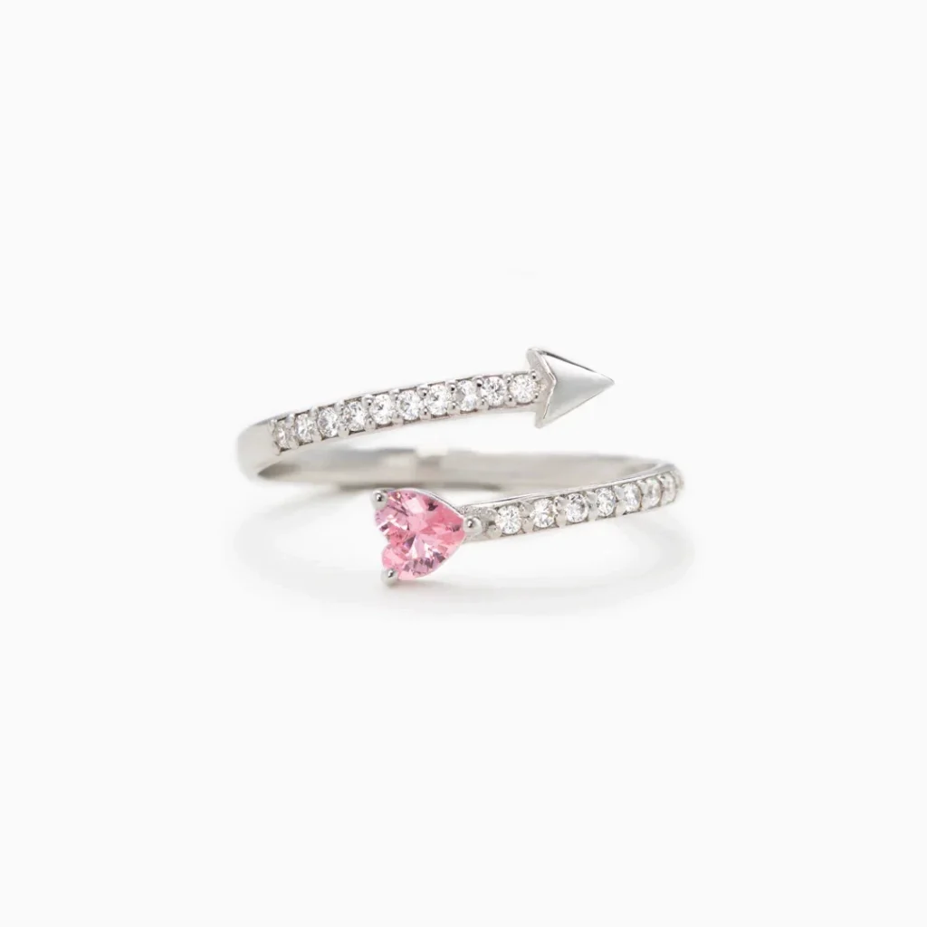 Discover our Cupid Arrow Pink Heart Ring in sterling silver – adjustable, hypoallergenic and gift-ready. A romantic wrap ring featuring a pink heart-cut zircon stone.